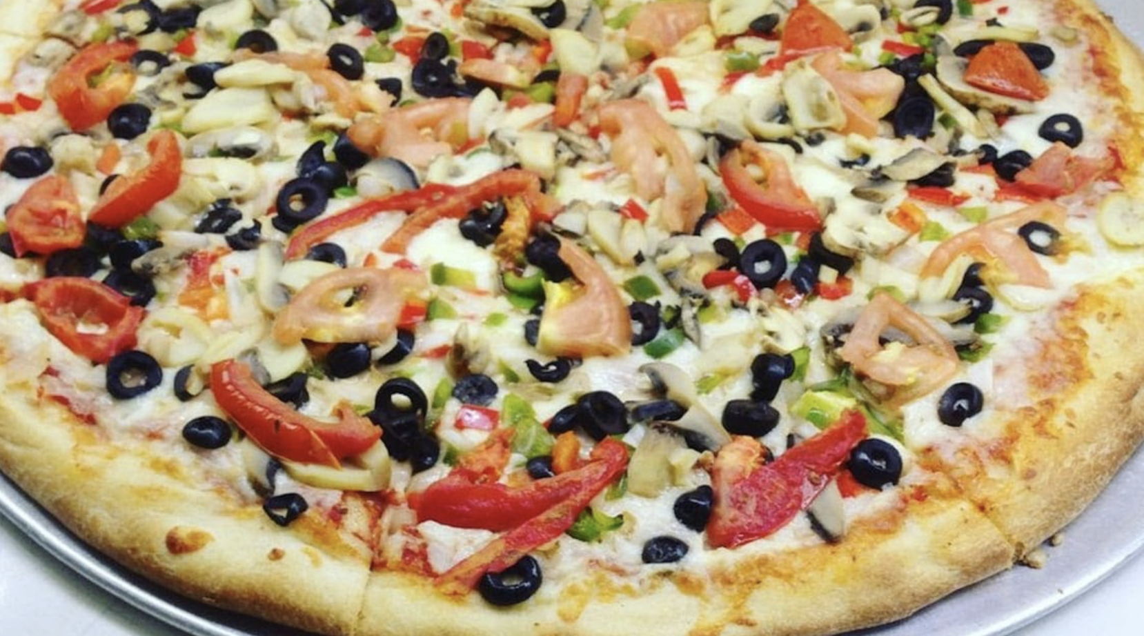 Vegetable pizza with olives and peppers